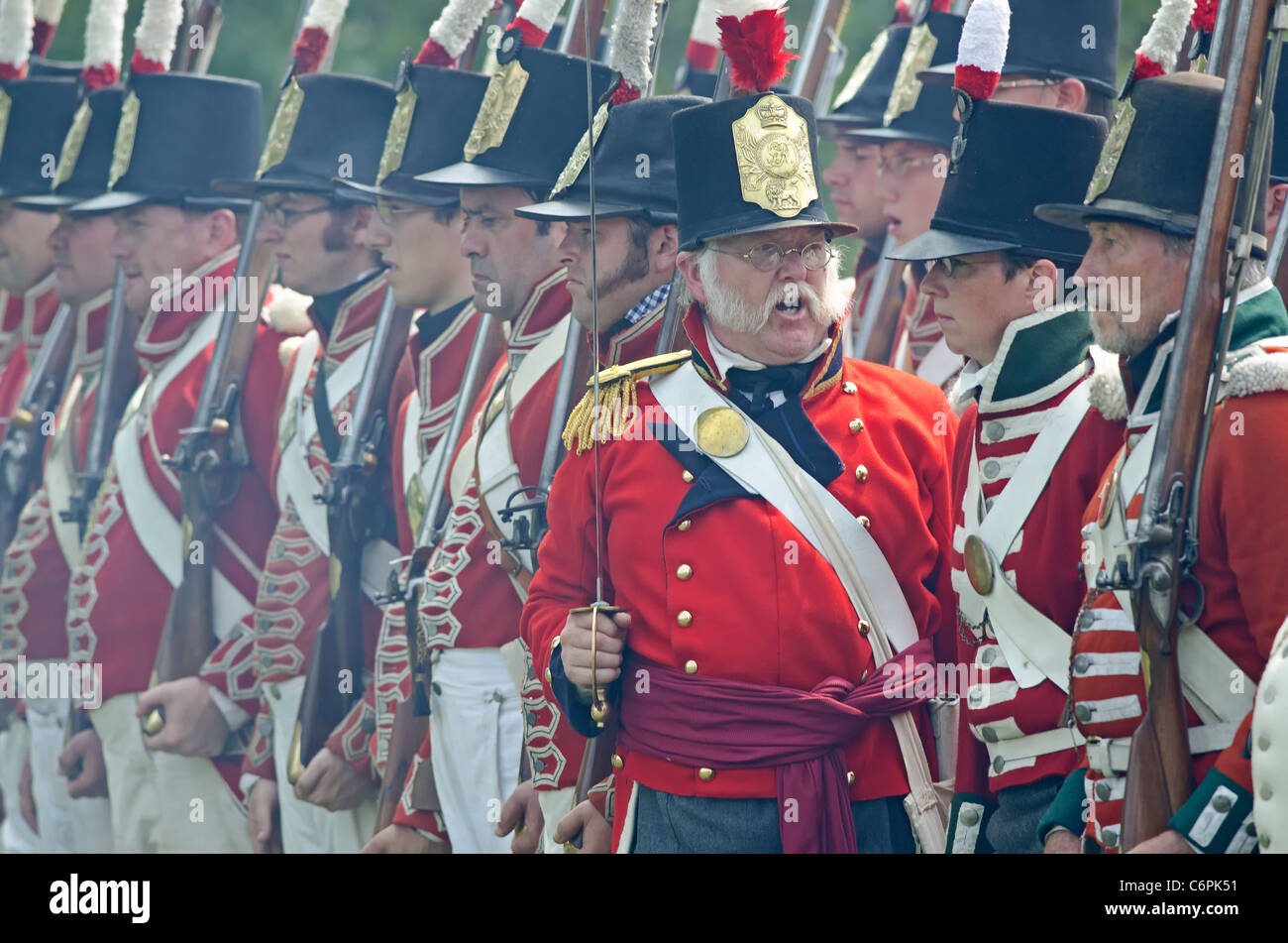 A British officer command his men in formation during the battle at the annual Siege of Fort Erie War of 1812 reenactment. Stock Photo