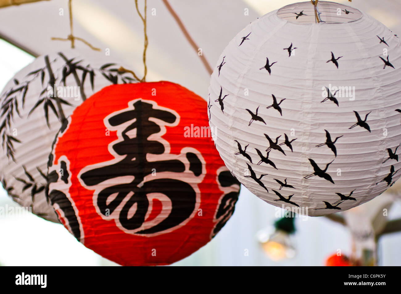 Red and white Japanese lanterns for sale at an outdoor festival Stock Photo  - Alamy