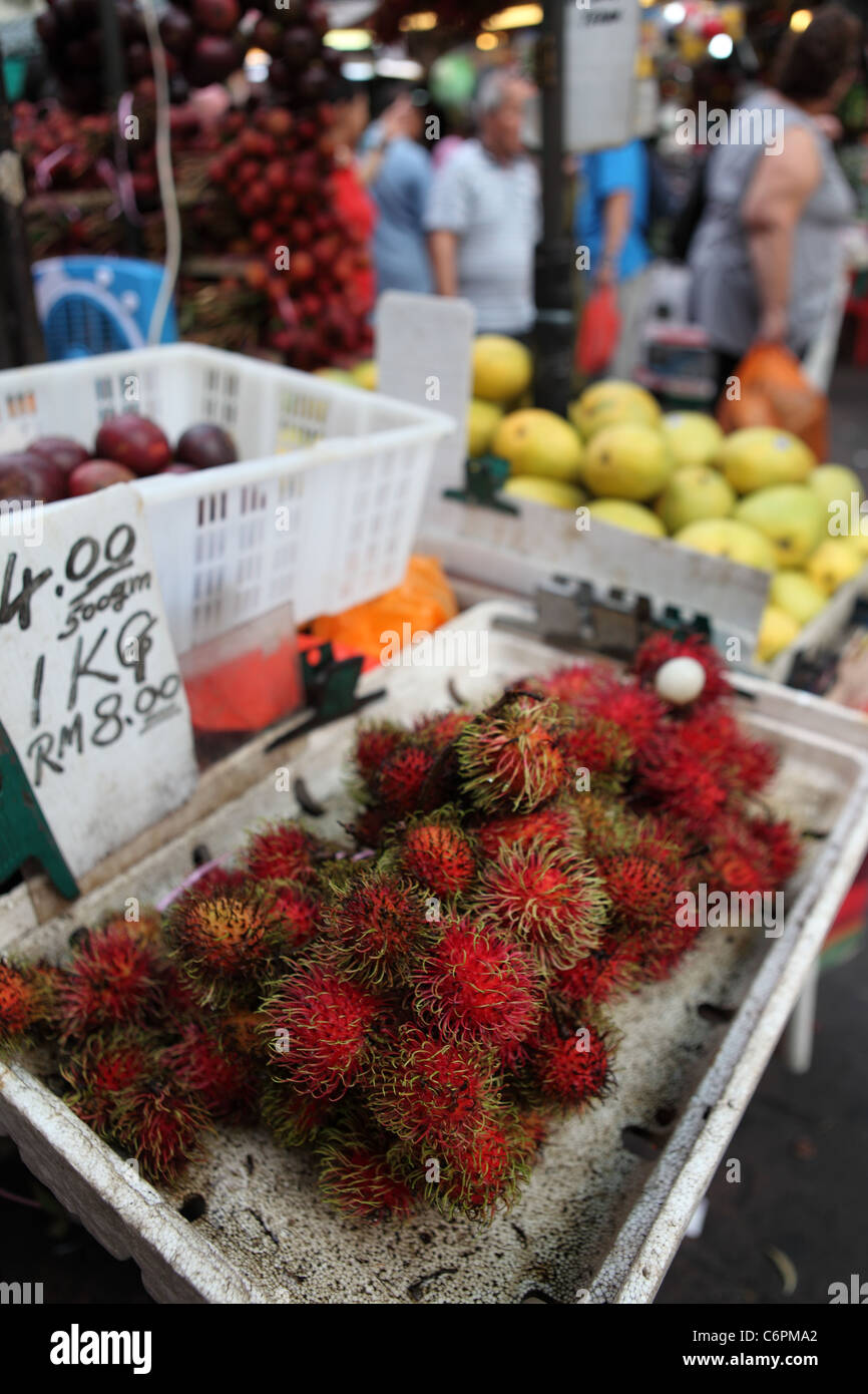 Rambutan on a fruit stand in Chinatown. Stock Photo