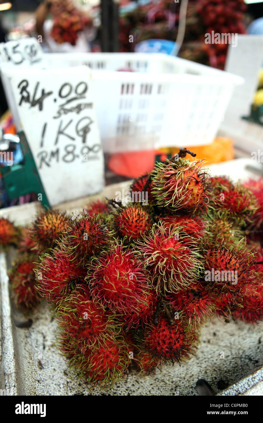 Detail of Rambutan on a fruit stand in Chinatown. Stock Photo