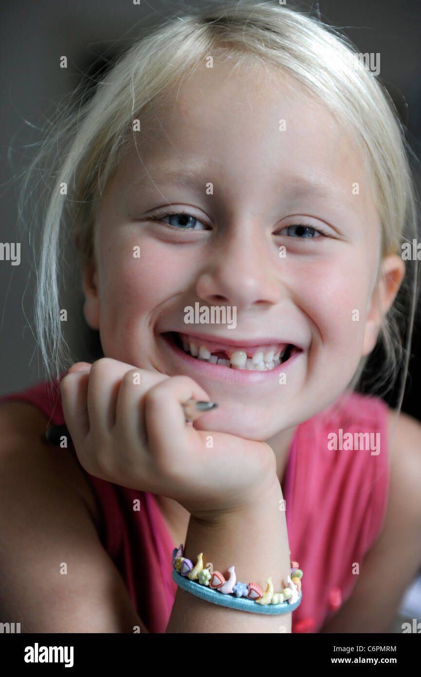 Portrait of a girl of six years with a tooth gap. Stock Photo
