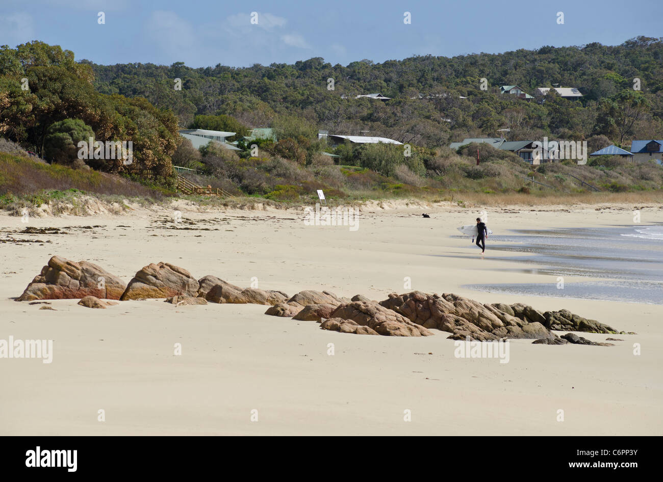 Lone surfer on a beach along Meelup Beach Rd, near Dunsborough, Western Australia Stock Photo