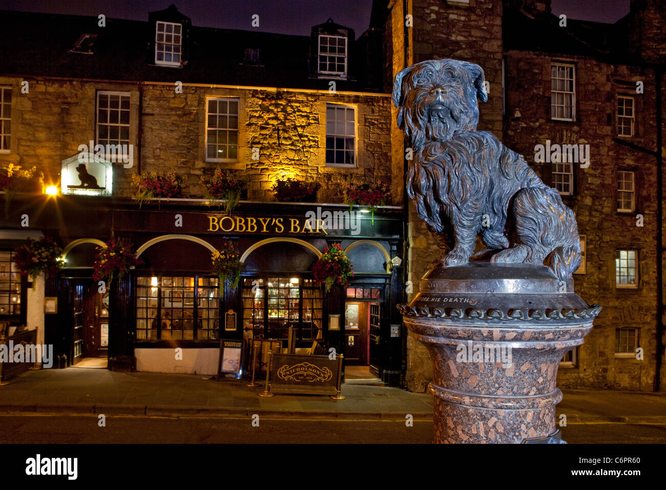 Famous faithful Greyfrairs Bobby dog statue and bar at night, Edinburgh, Scotland Stock Photo