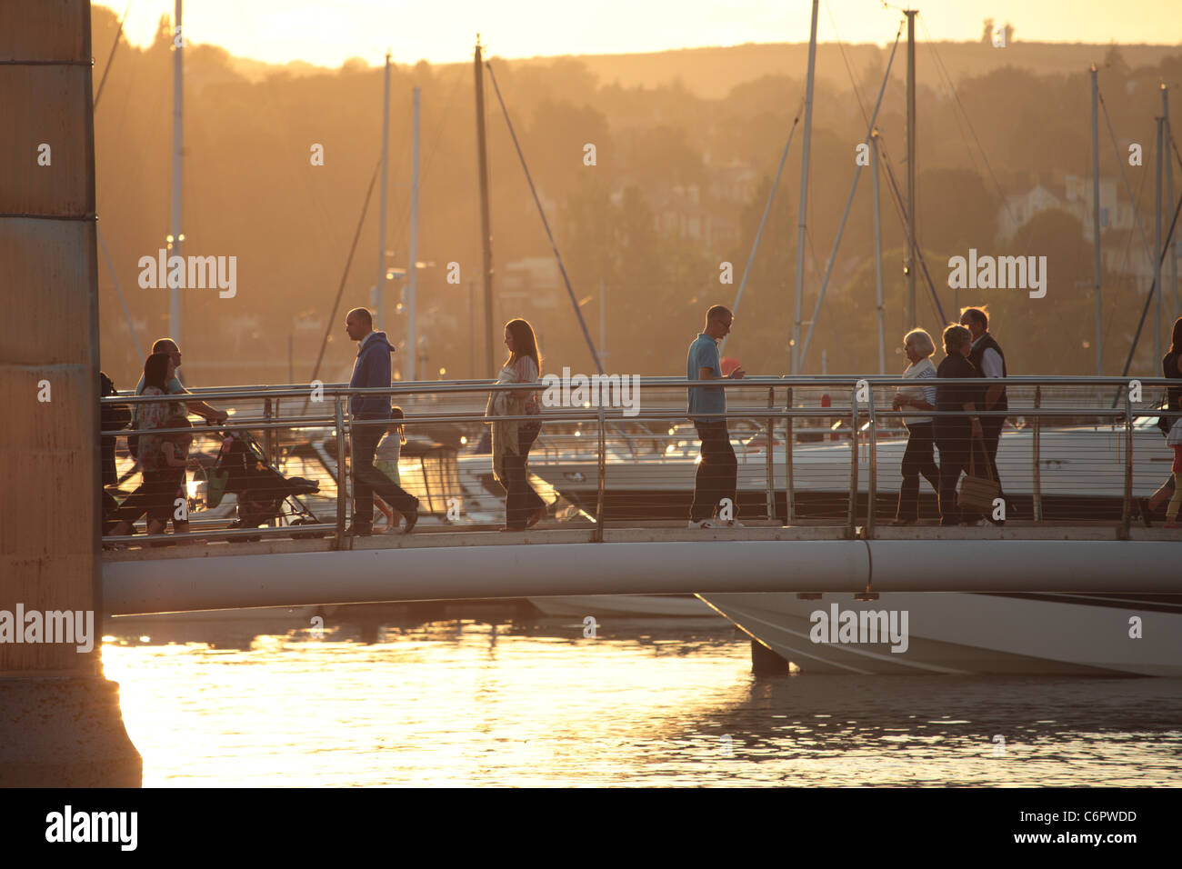 People crossing a marina footbridge, Torquay, Devon UK Stock Photo Alamy