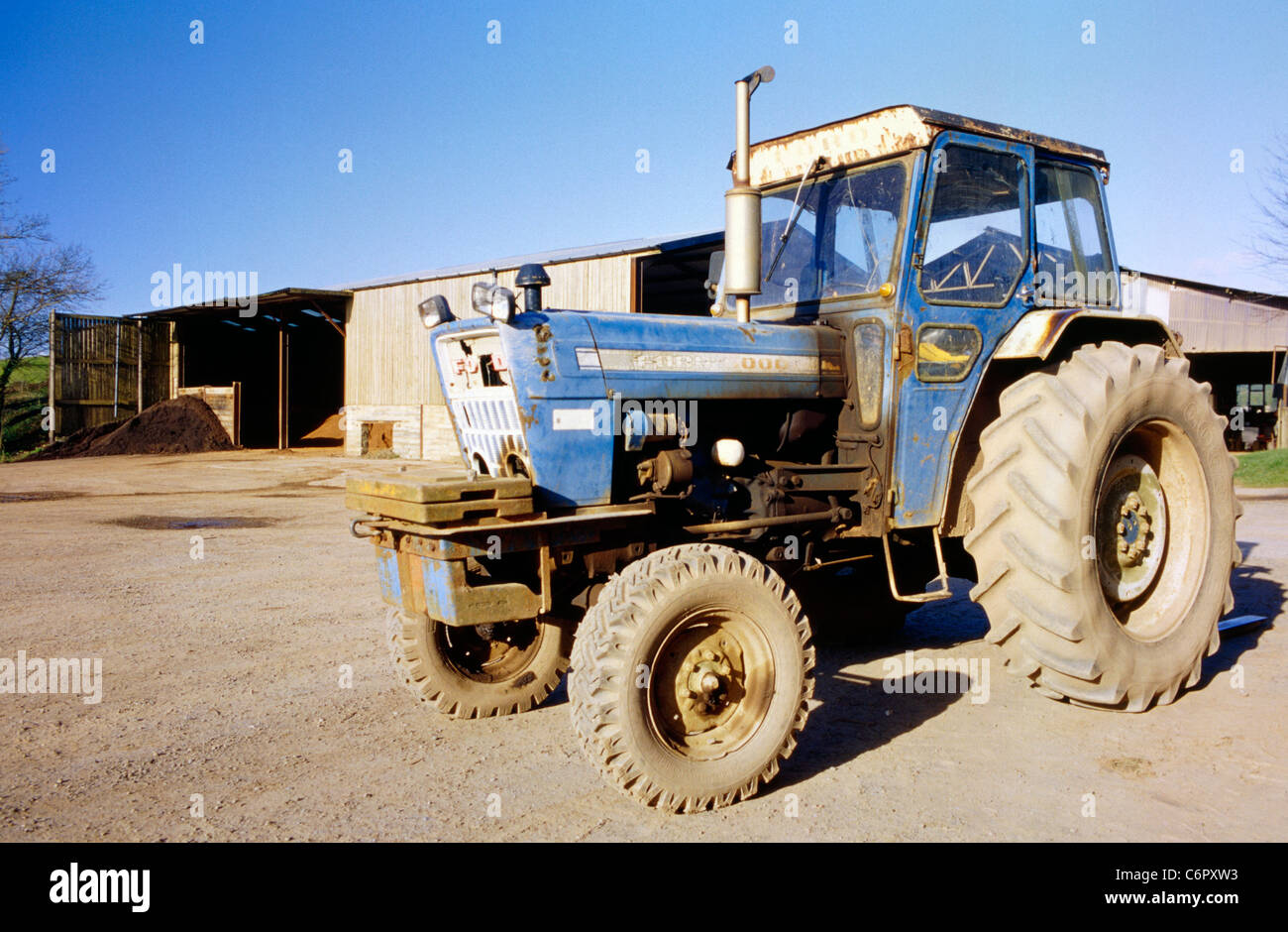 Old Ford Tractor in yard. Stock Photo