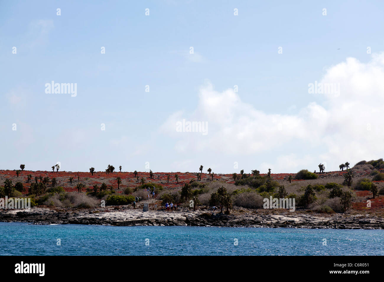 Tourists at the rocky landing site at North Seymour, Galapagos Islands Stock Photo