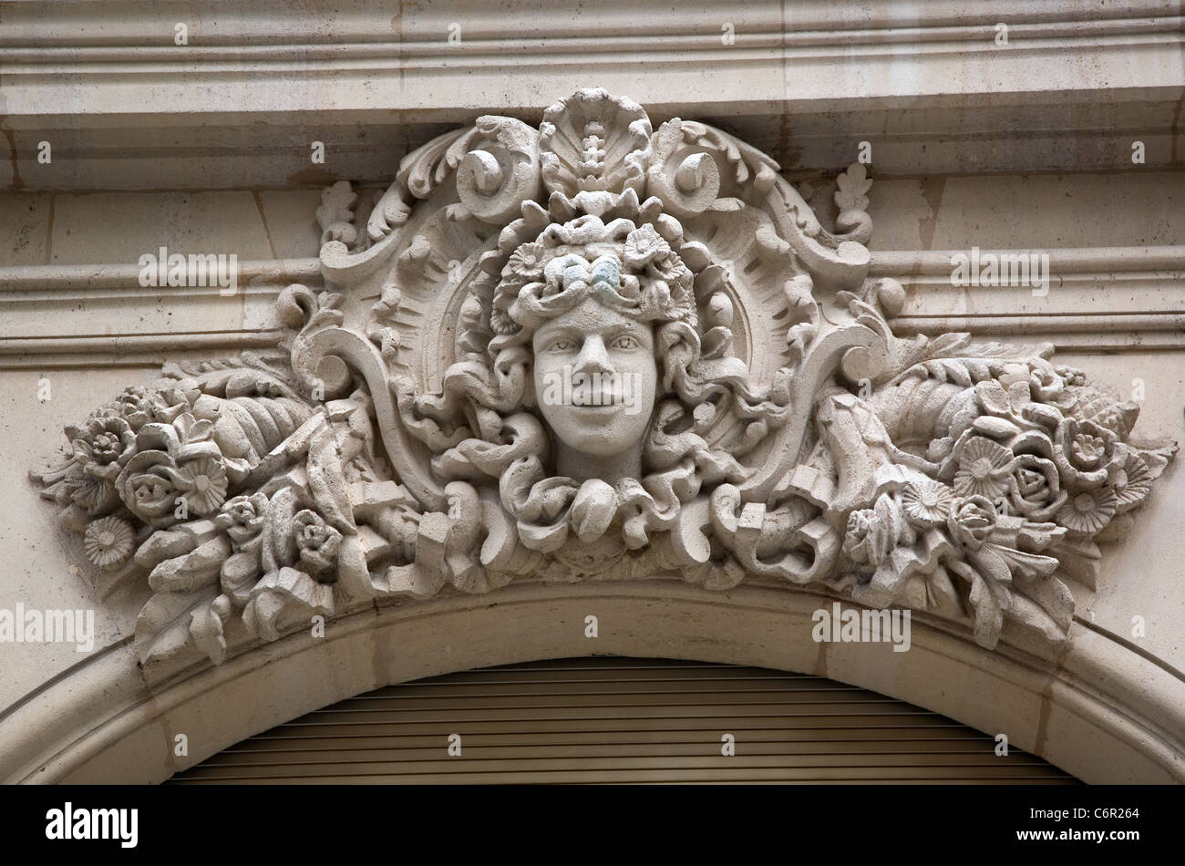 Decorative stone carving above doorway in Geneva Stock Photo