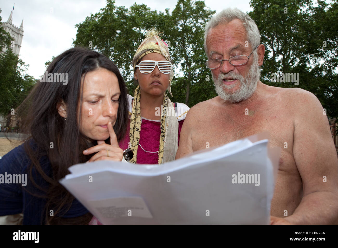 Residents of democracy village read the eviction papers. Today is