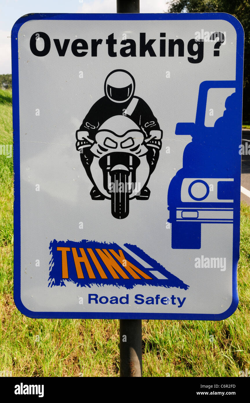 Overtaking? Think Road Safety Roadsign near Littleport, Cambridgeshire, England, UK Stock Photo