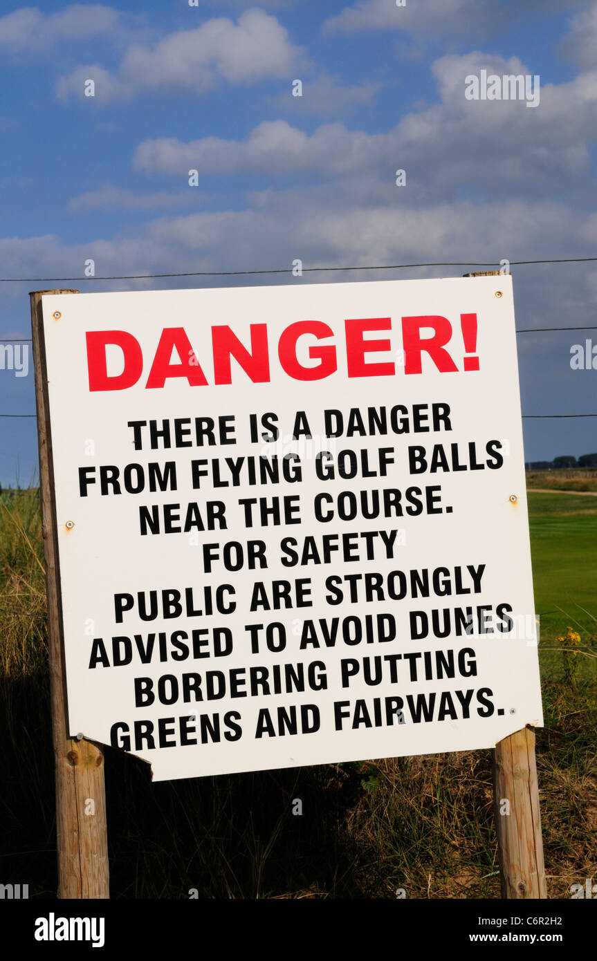 Danger From Flying Golf Balls Notice, Royal West Norfolk Golf Club, Brancaster, Norfolk, England, UK Stock Photo