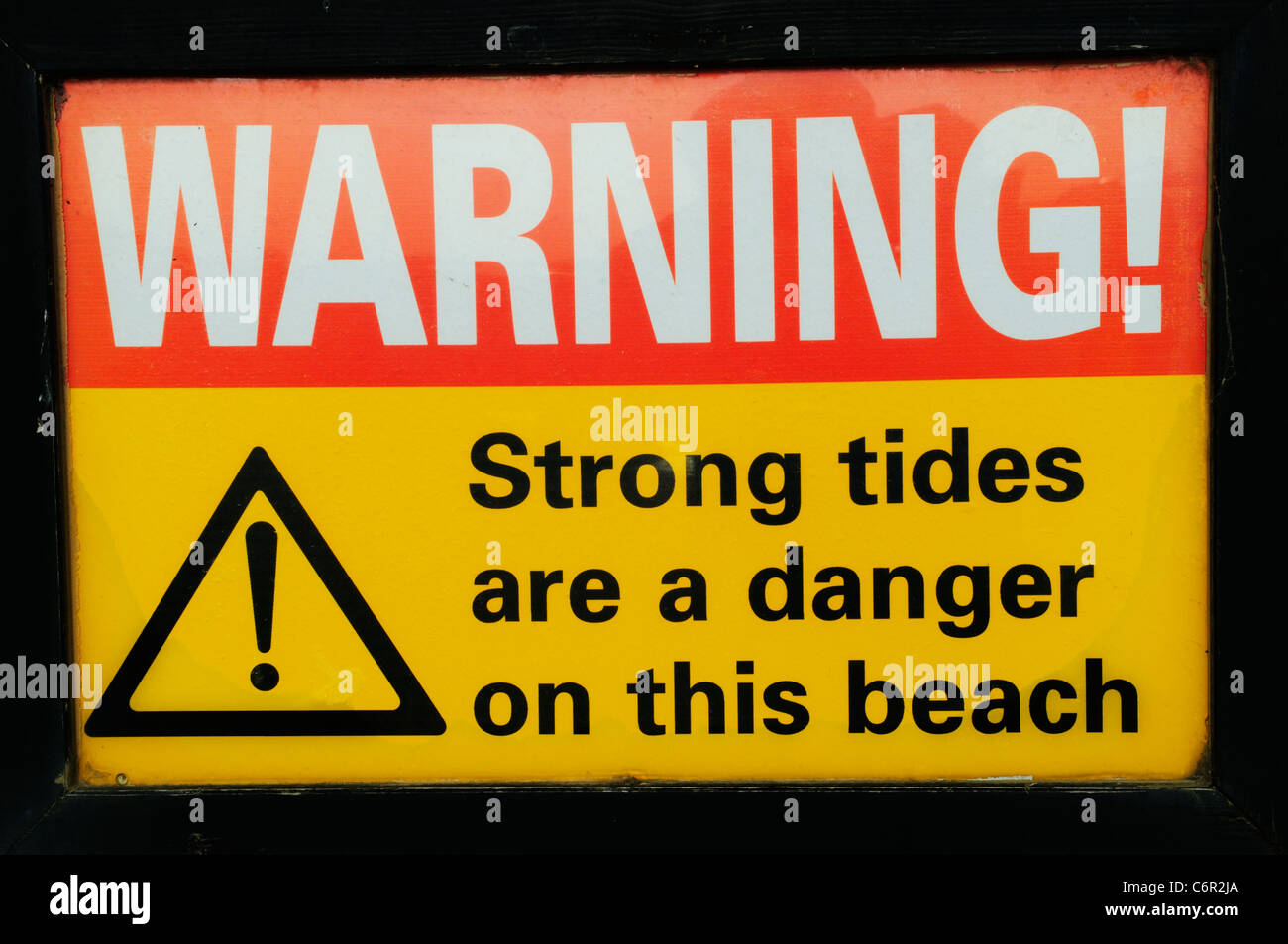 Warning! Strong Tides Are A Danger On This Beach safety sign, Brancaster, Norfolk, England, UK Stock Photo
