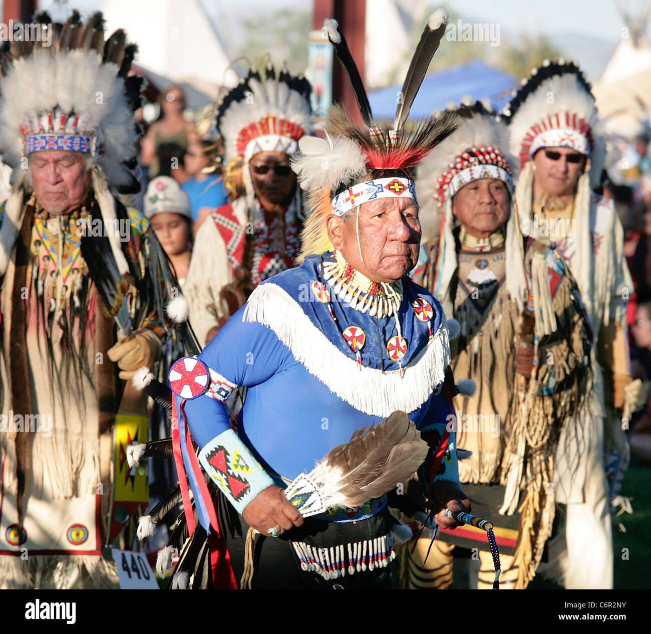 Dancers leading the Grand Entry part of a powwow held during the annual Shoshone-Bannock Festival in Ft. Hall, Idaho. Stock Photo