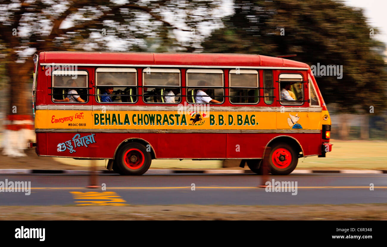 Indian bus speeds along a road in Kolkata, West Bengal, India Stock Photo