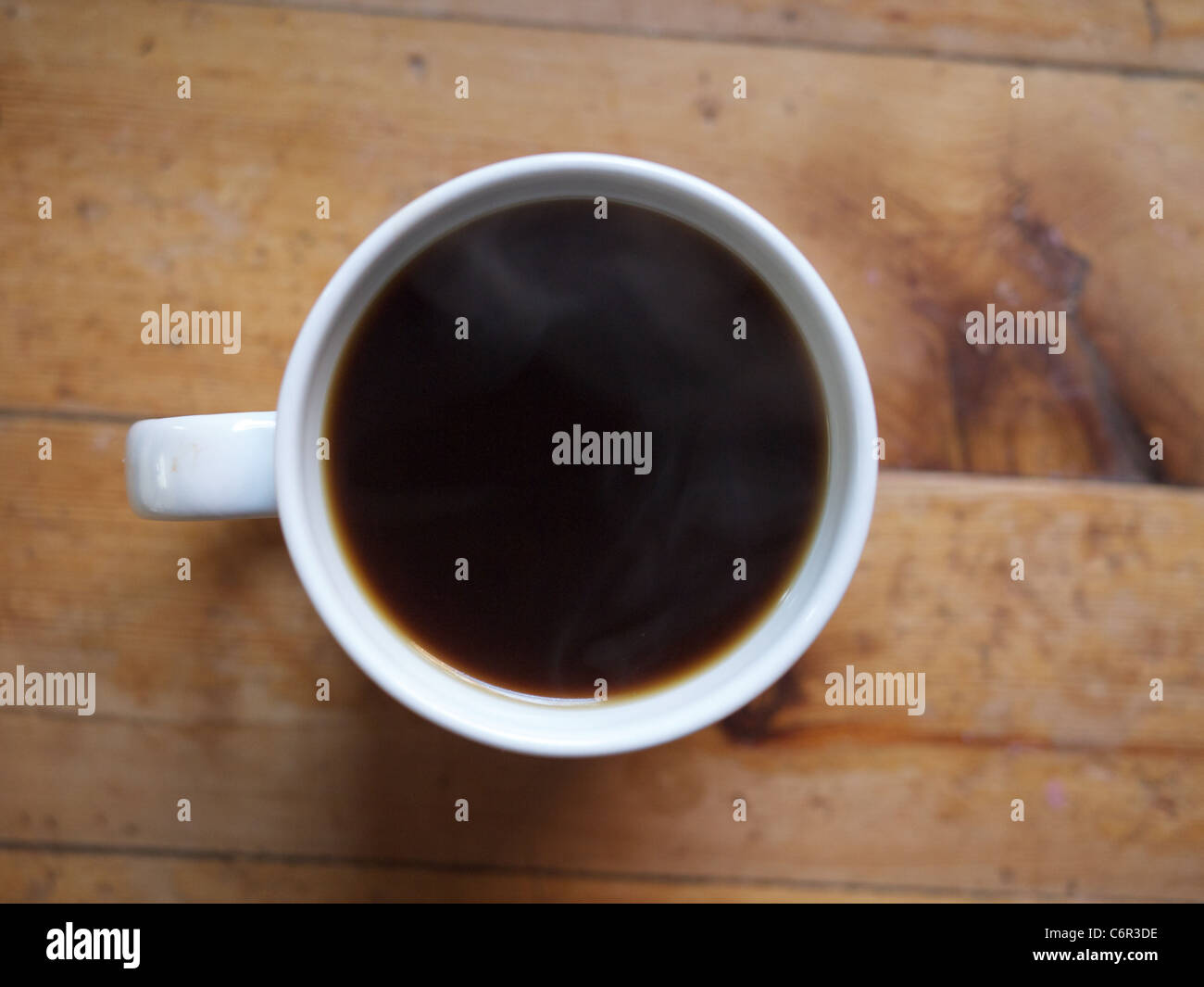 Black Coffee in a white cup on a wooden table Stock Photo