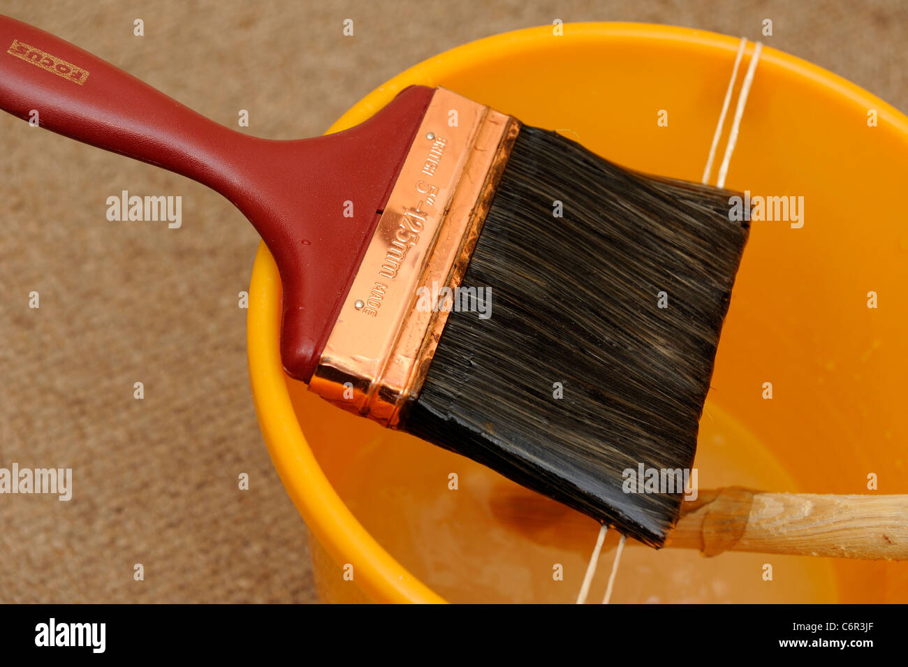 pasting brush and bucket england uk Stock Photo