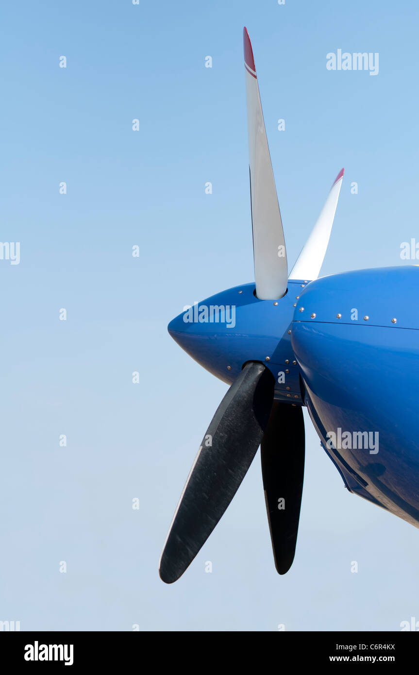 White plane propeller on blue sky background Stock Photo