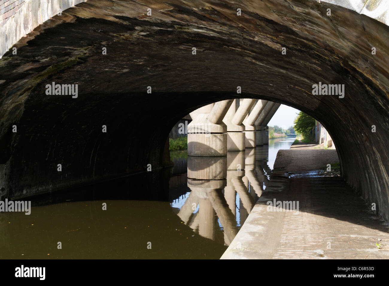 Motorway support stanchions in the middle of the canal Stock Photo