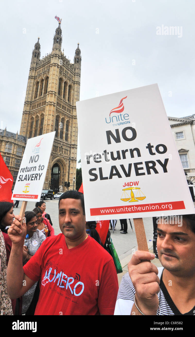 Migrant Immigrant Domestic workers demonstrating outside Parliament against proposed changes to UK visa Stock Photo