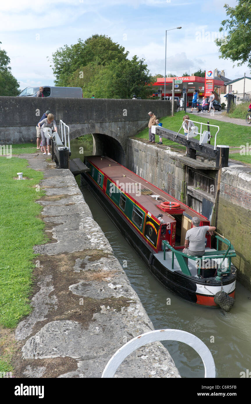 Narrow boat leaving locks at Devizes Stock Photo