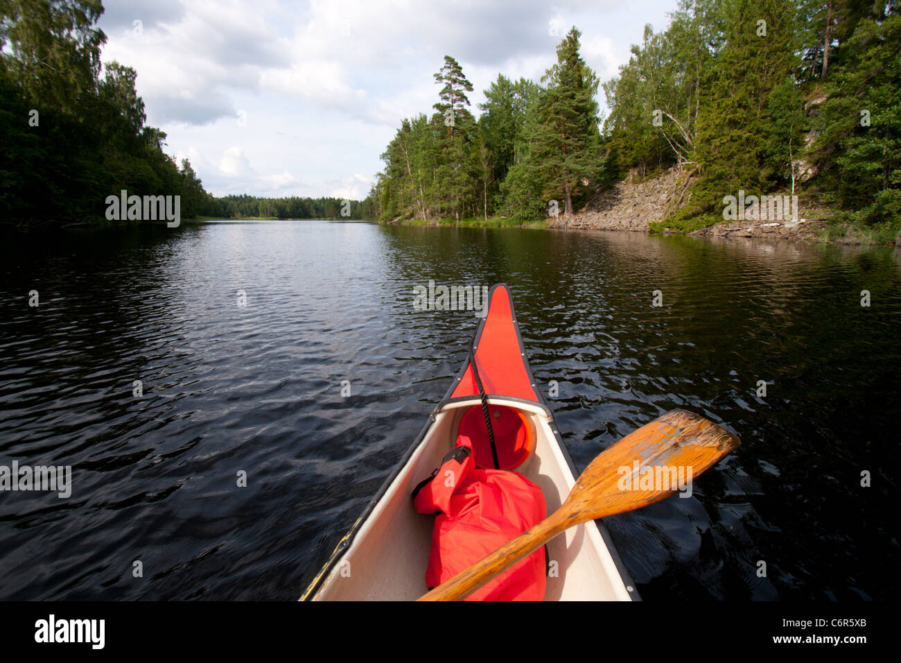 canoe on a quiet lake Stock Photo