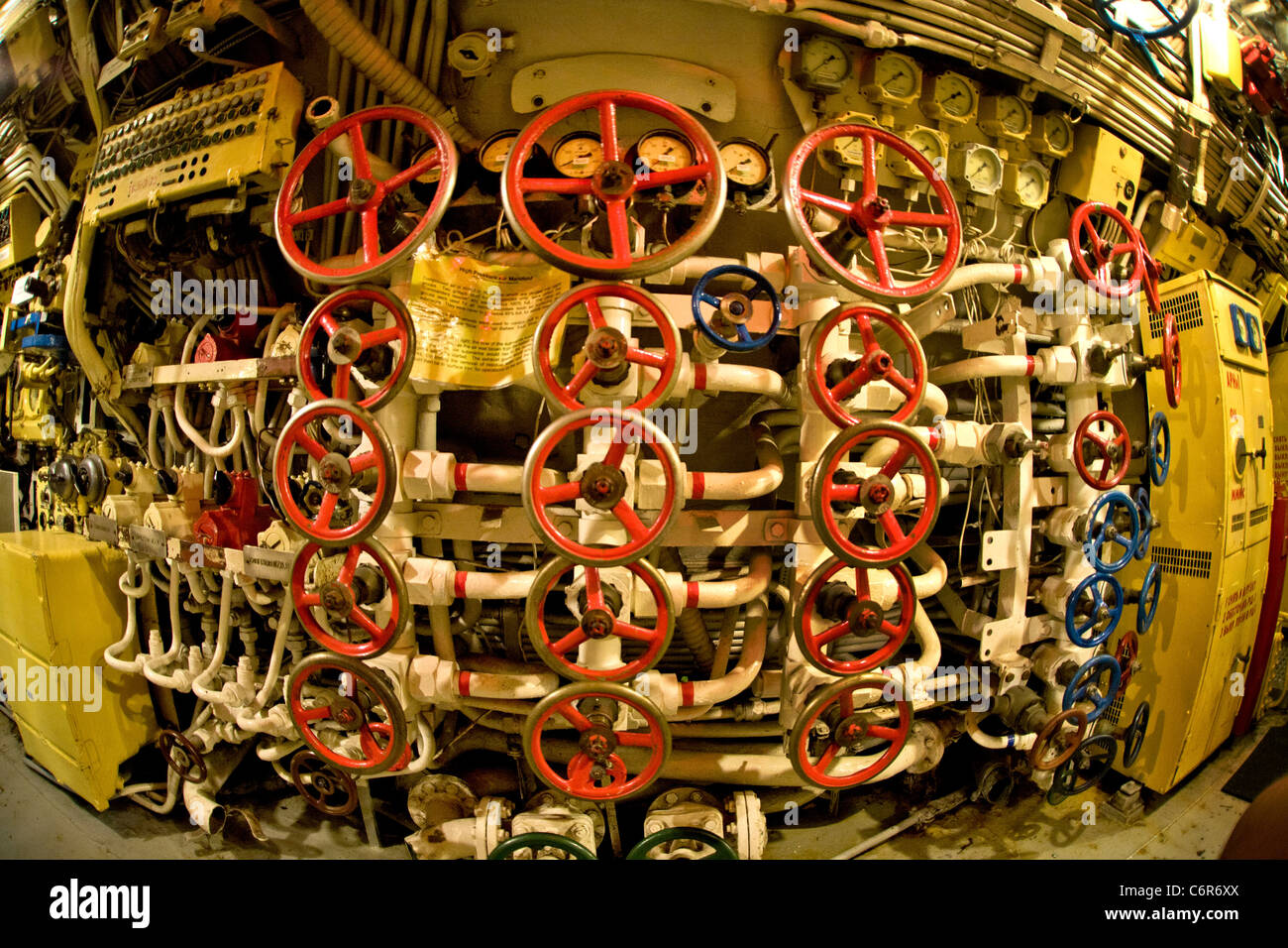 Valves of the high pressure manifold fill a bulkhead in the control room of the Soviet diesel-electric submarine B-39. Stock Photo