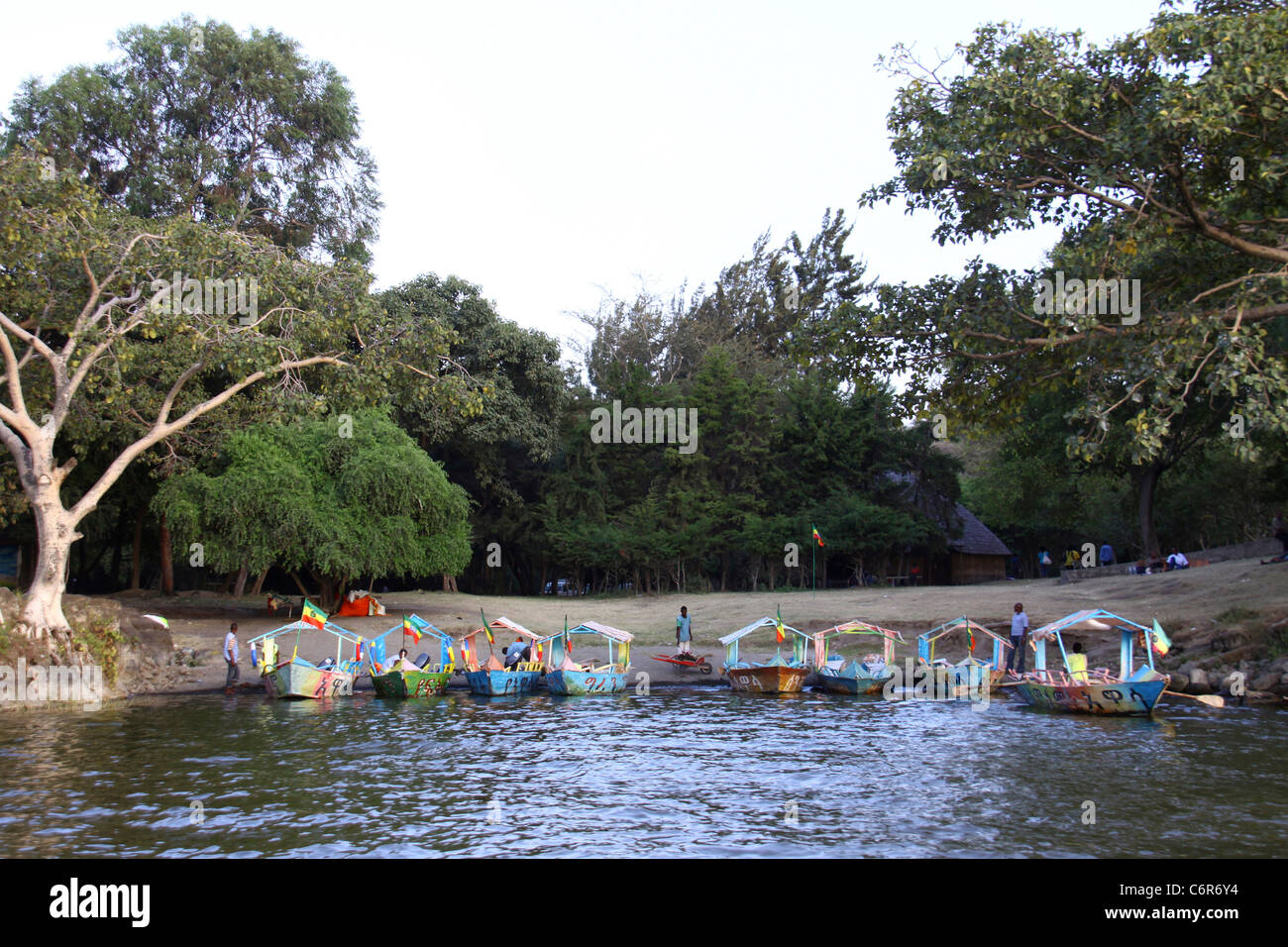 Brightly coloured boats moored on the shore of Lake Awassa Stock Photo
