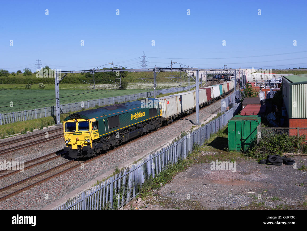 Freightliner 66565 heads  4M61 Southampton to Trafford Park intgermodal along the Trent Valley section on the WCML at Lichfield Stock Photo