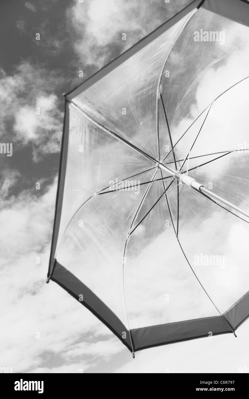 Umbrella with sky background in black and white Stock Photo