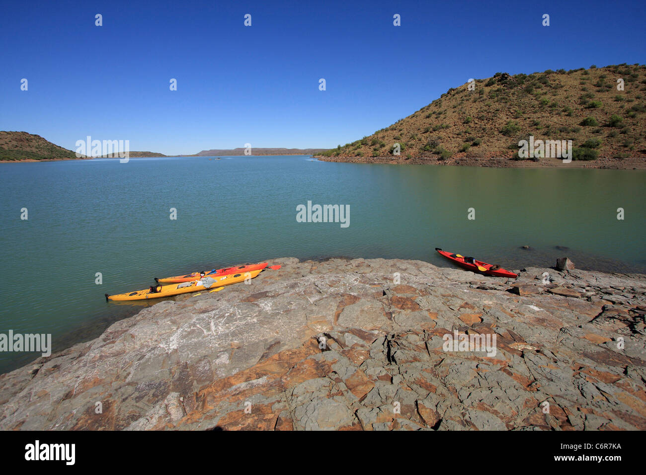 Kayaks on rock island in Van Der Kloof Dam Stock Photo Alamy
