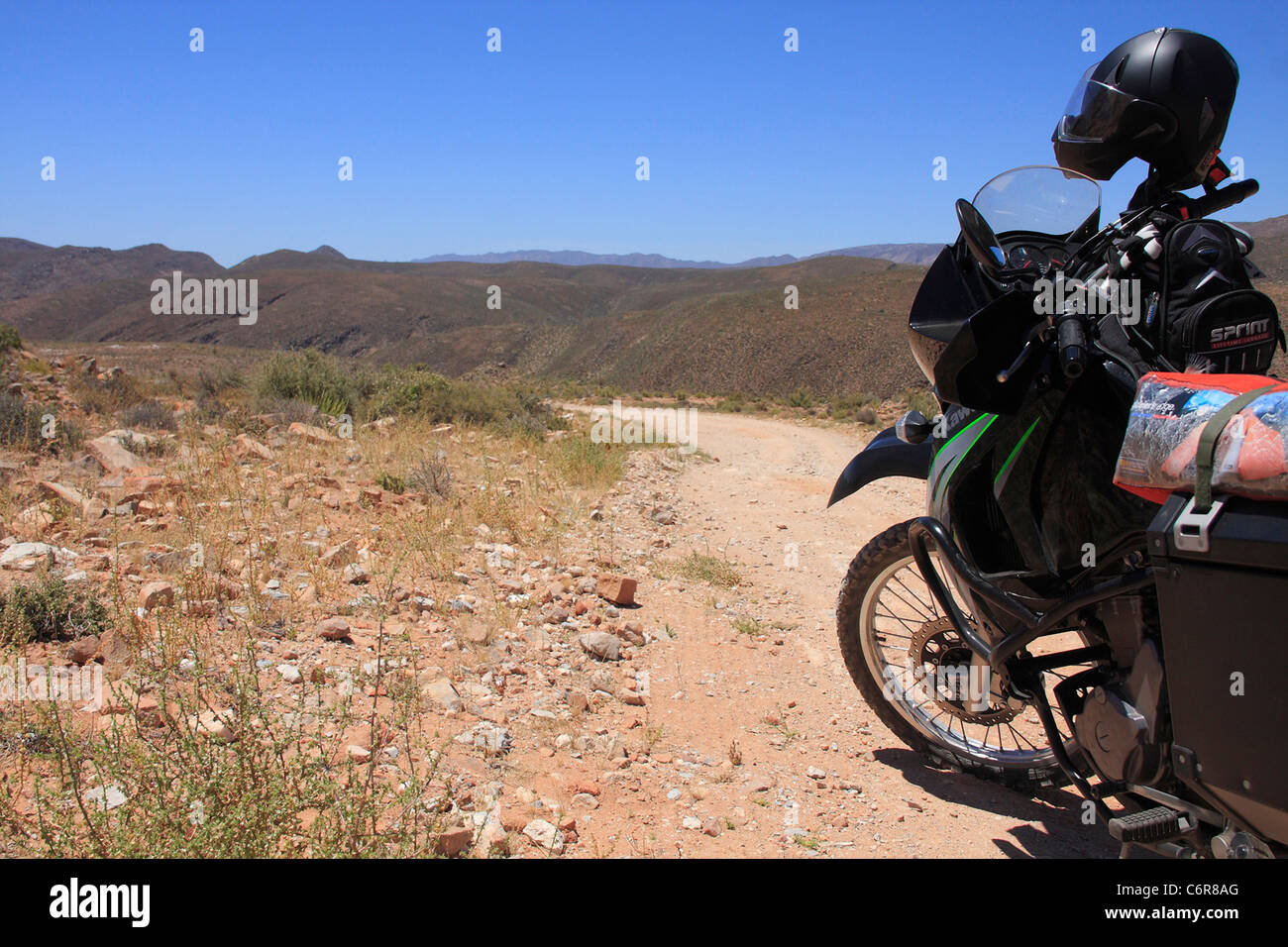 Dust road running through the Richtersveld with motorcycle Stock Photo
