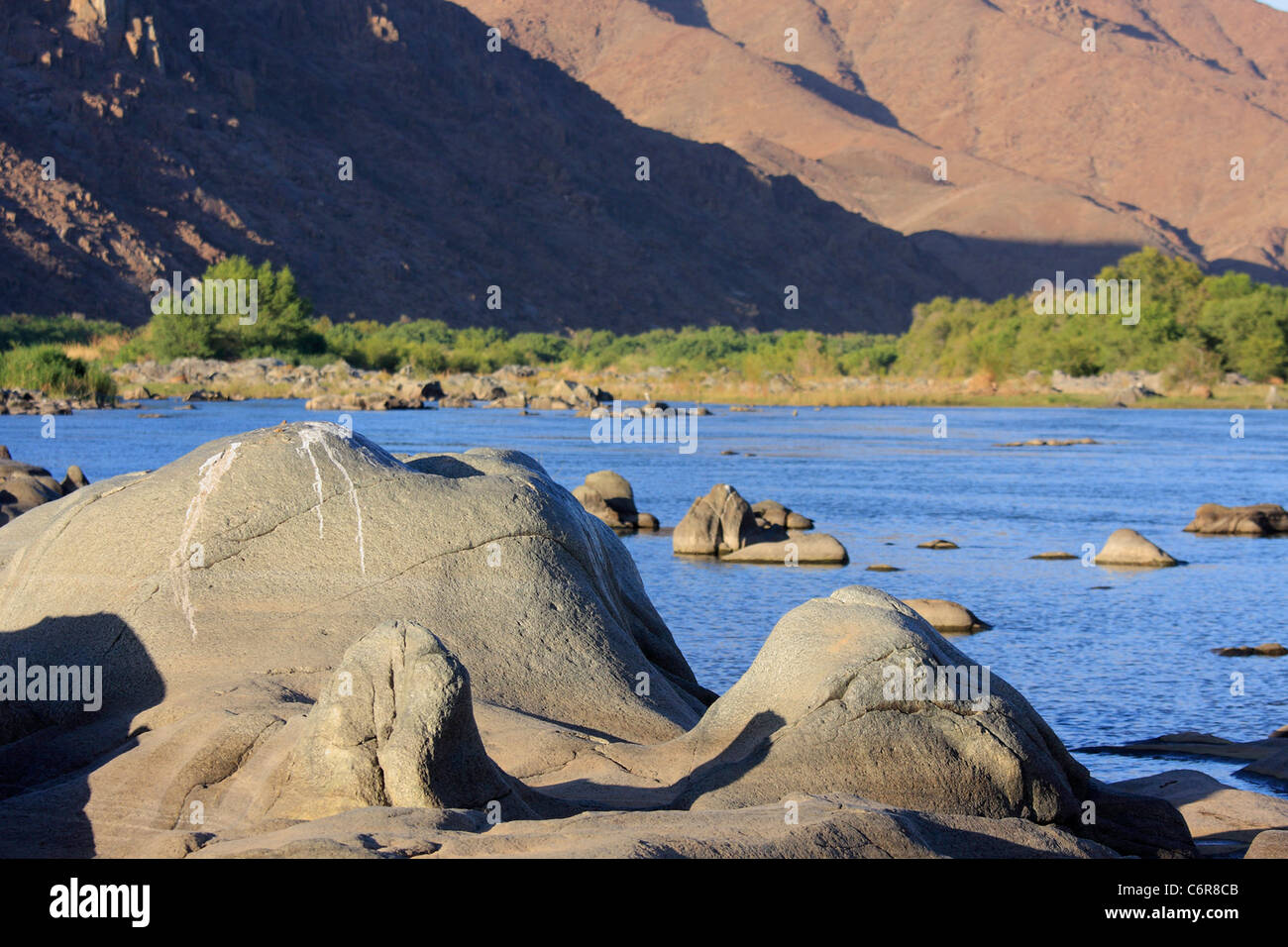 Orange river landscape rocks in the foreground Stock Photo
