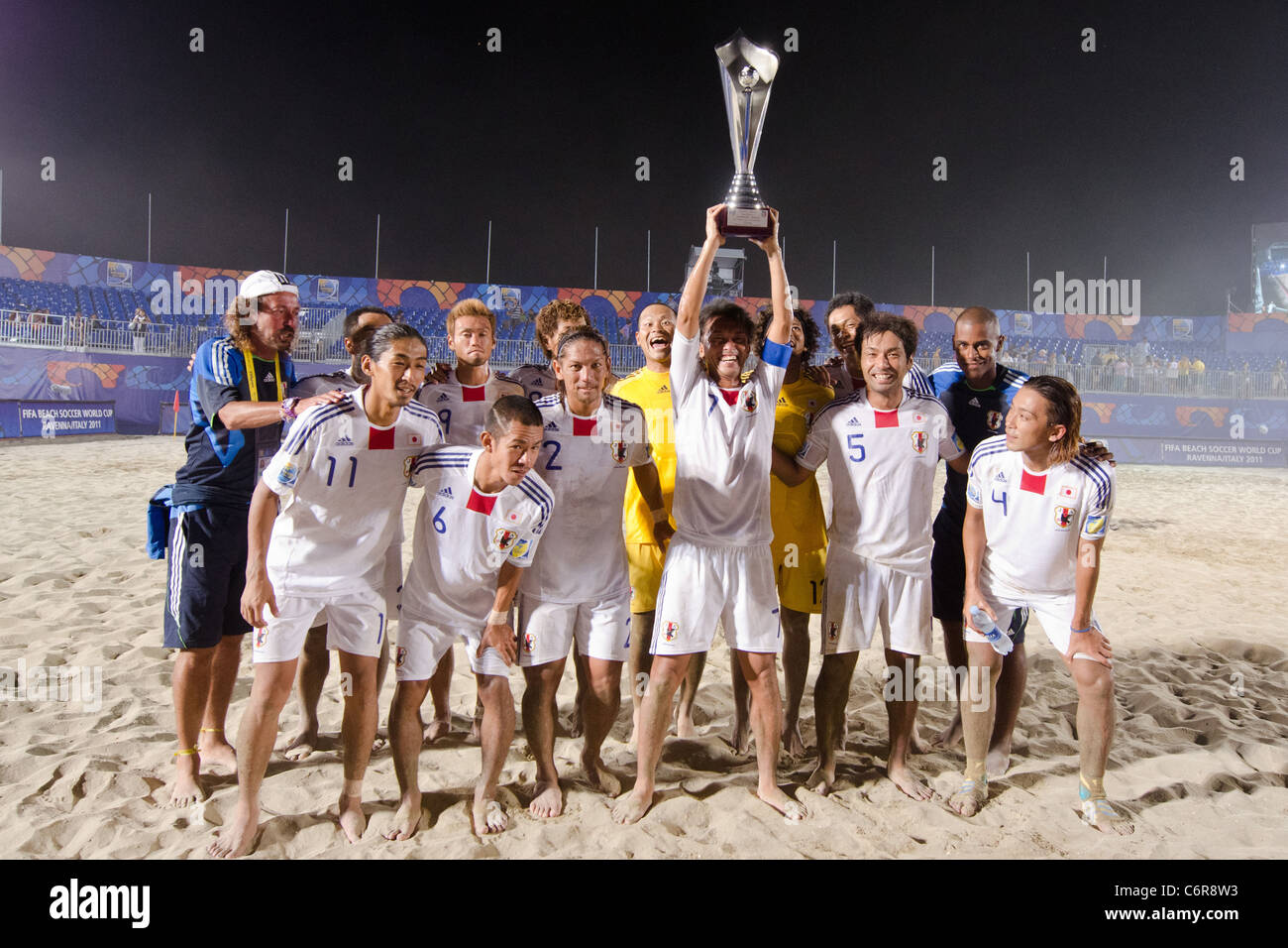 Beach Soccer : Japan team group line-up for the e Crescentini Trophy match between Italy 1-2 Japan. Stock Photo