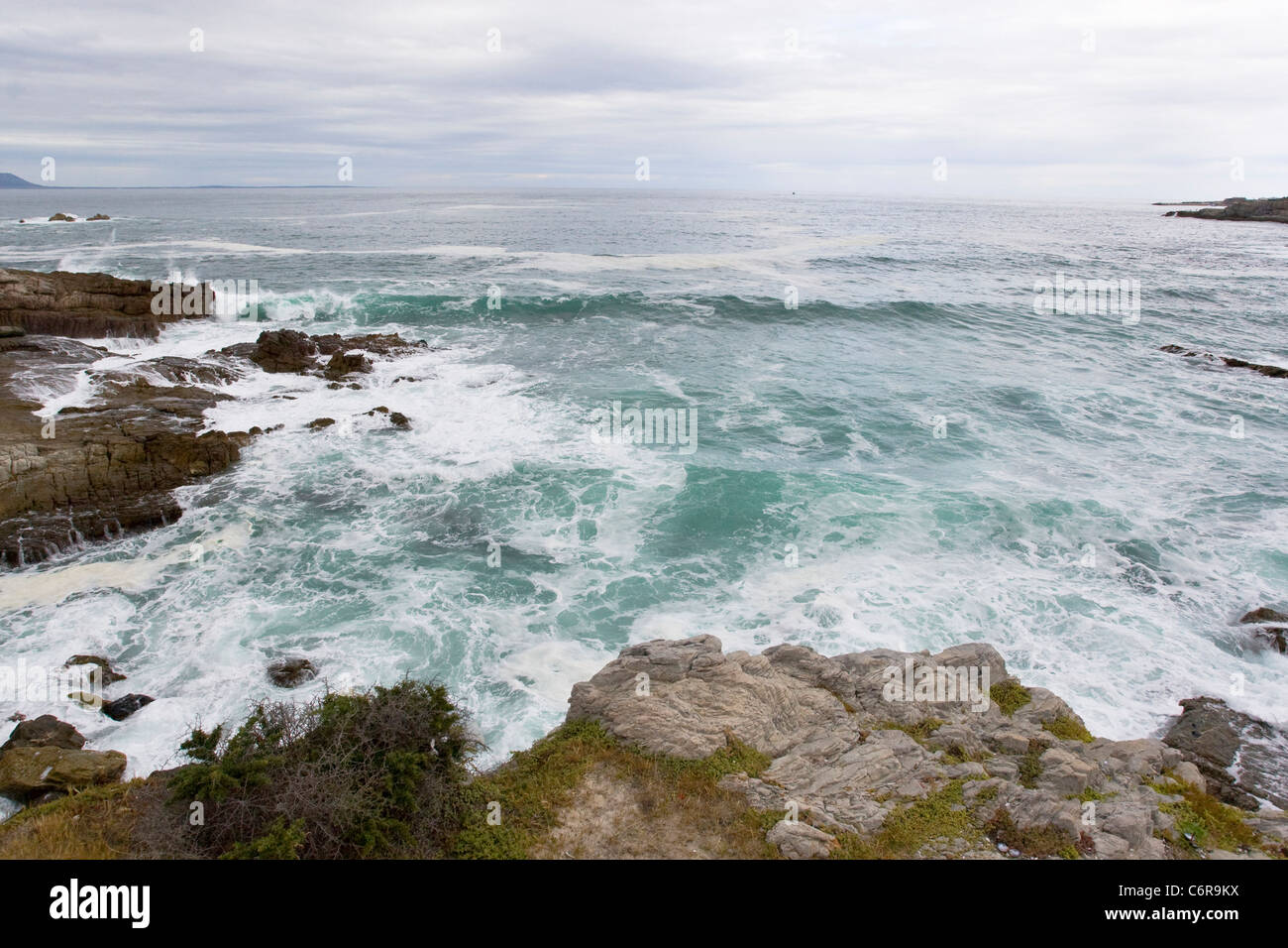View over the ocean and rocky coastline at Hermanus Stock Photo