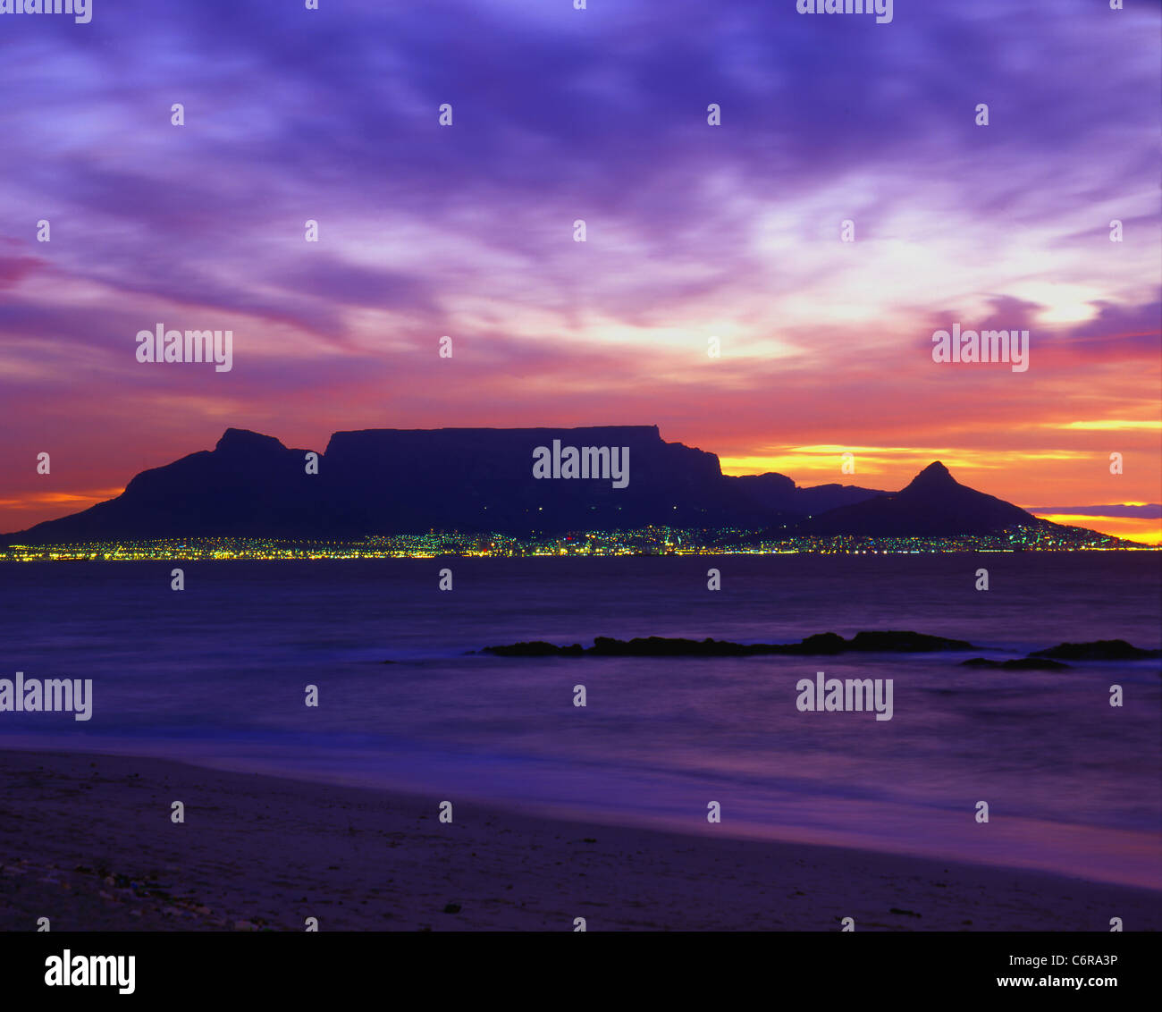 Table mountain at sunset, viewed from Blouberg beach with dramatic purple sky Stock Photo