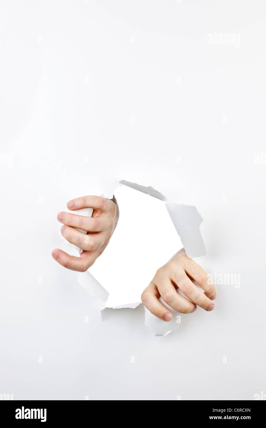 Two hands tearing paper hi-res stock photography and images - Alamy