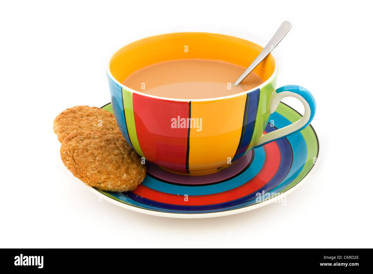 Stripy cup and saucer with two biscuits isolated on white Stock Photo