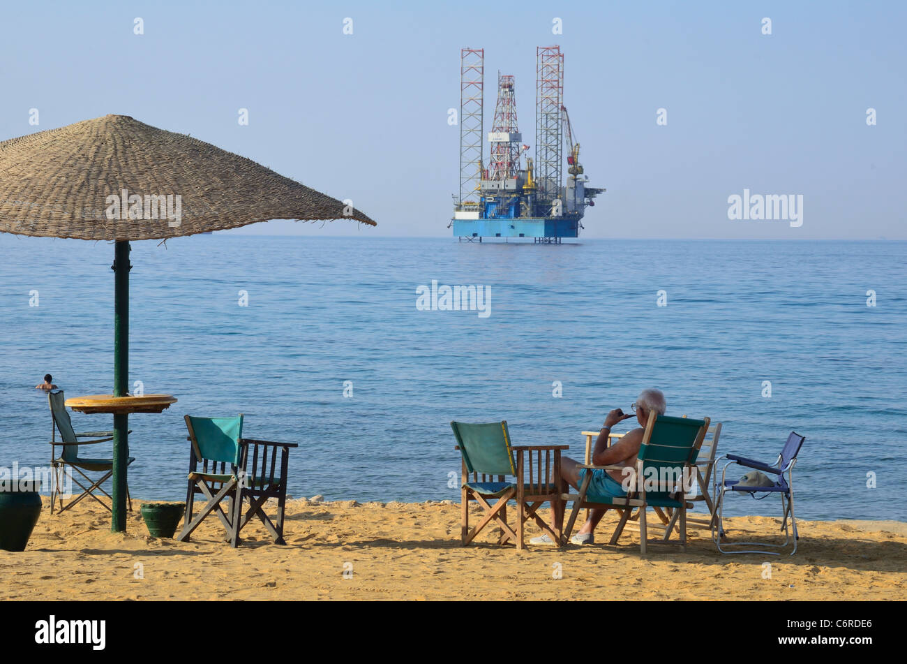 A jackup oil rig lies in the shallow waters of the Red Sea off the coast of Egypt at Ain Sokhna. Stock Photo