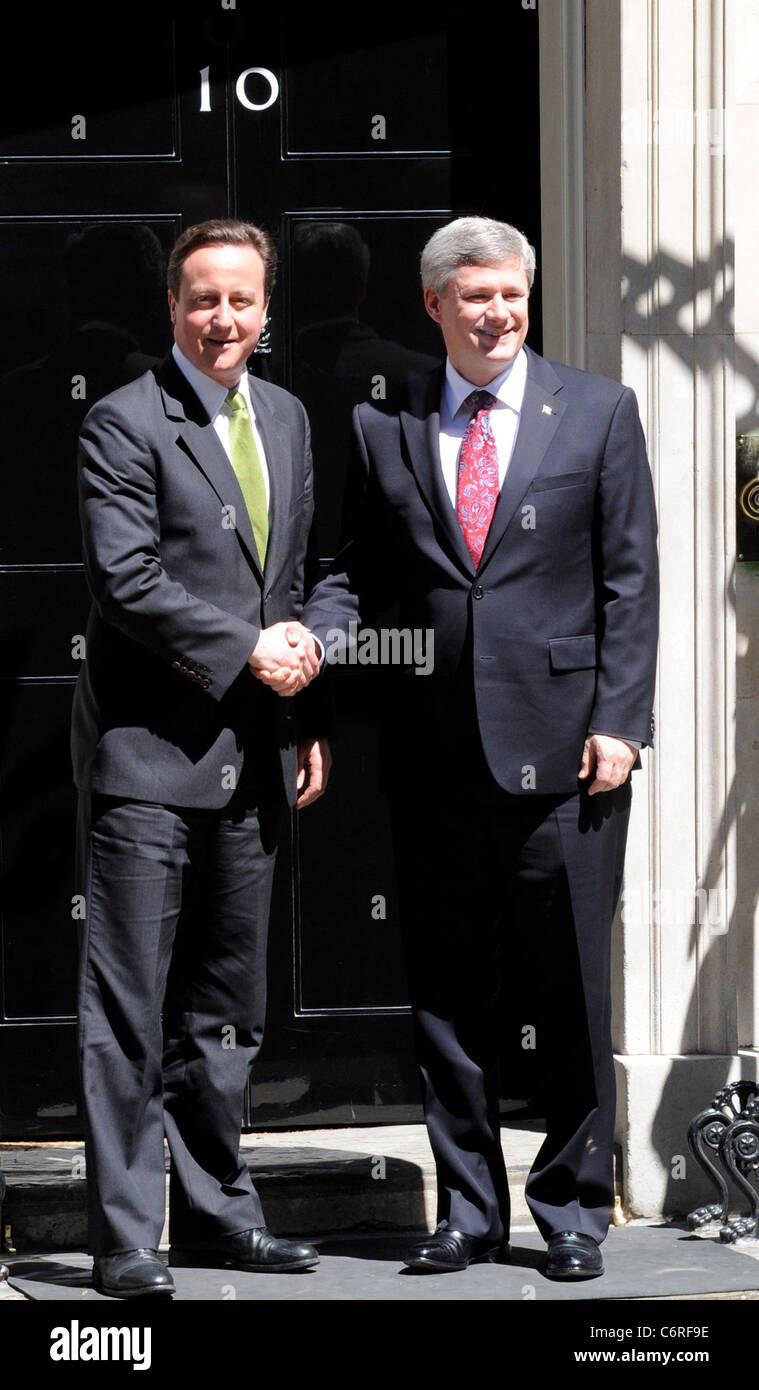 Prime minister David Cameron shaking hands with Canadian Prime Minster ...