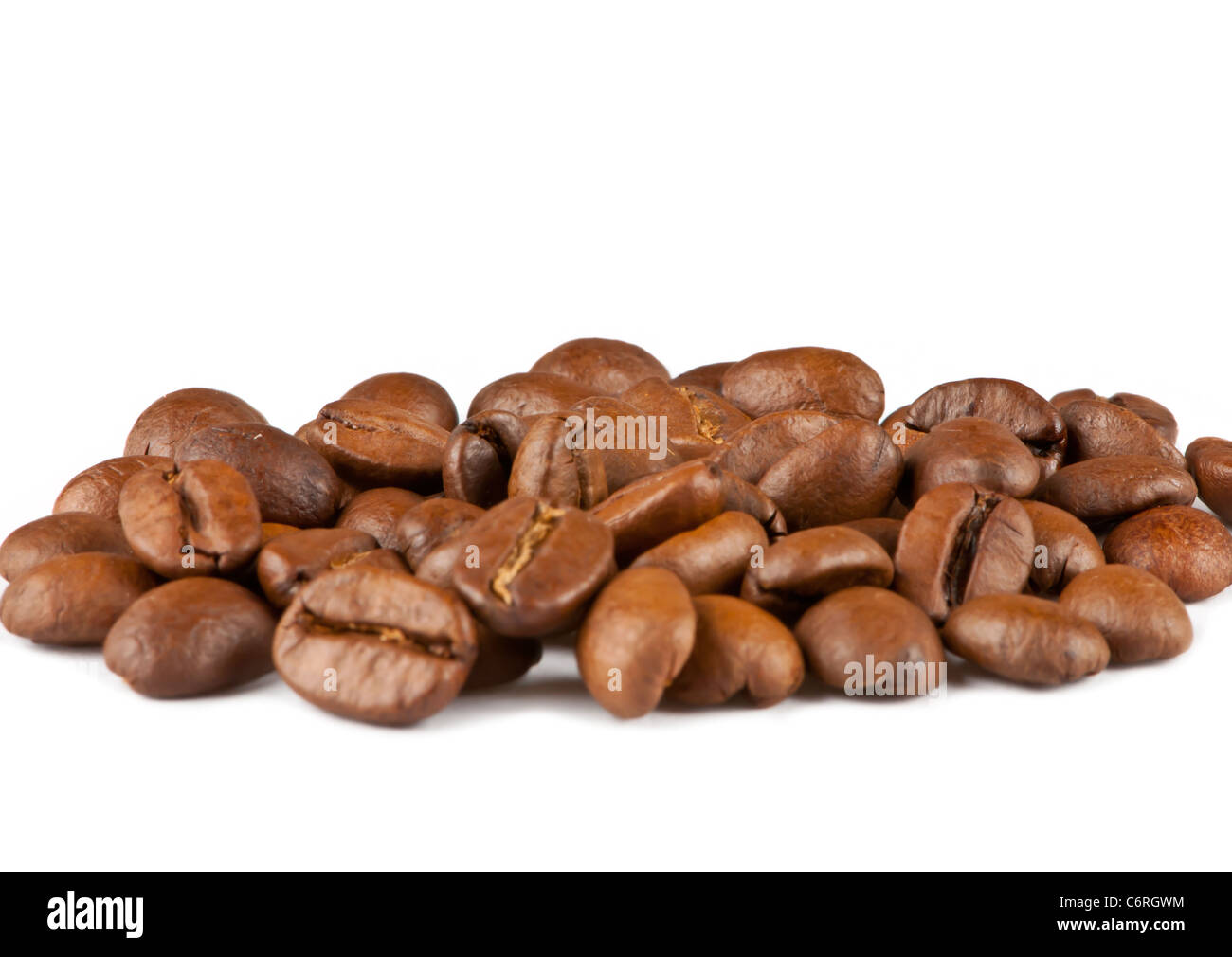 Brown roasted coffee beans isolated on white background Stock Photo - Alamy