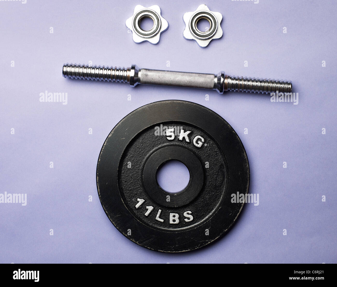 Deconstructed dumbbell weight in the shape of a face Stock Photo