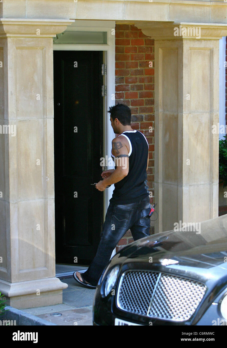 Peter Andre outside his hotel with a Louis Vuitton man bag London