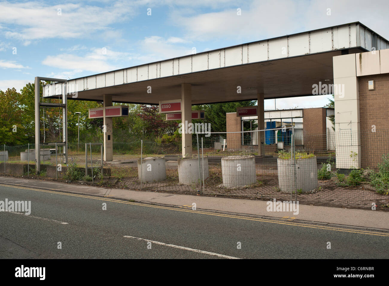 An abandoned closed out of business shut down Esso petrol filling station garage , wrexham, north east wales, UK Stock Photo