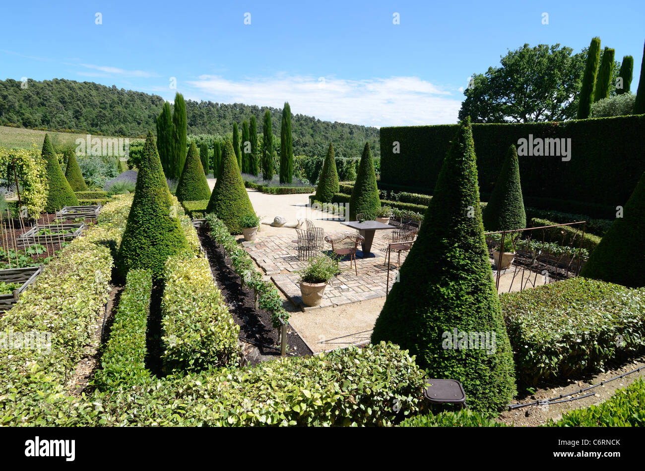Topiary or Trimmed Cypress Trees & Outdoor Terrace at the Val Joannis Gardens, Domaine or Wine Estate, Pertuis Luberon Provence Stock Photo