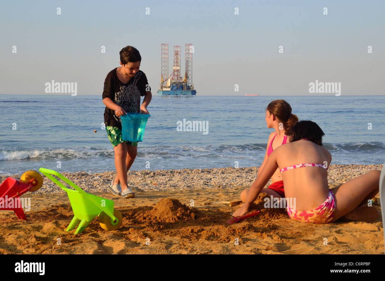 A jackup oil rig lies in the shallow waters of the Red Sea off the coast of Egypt at Ain Sokhna. Stock Photo