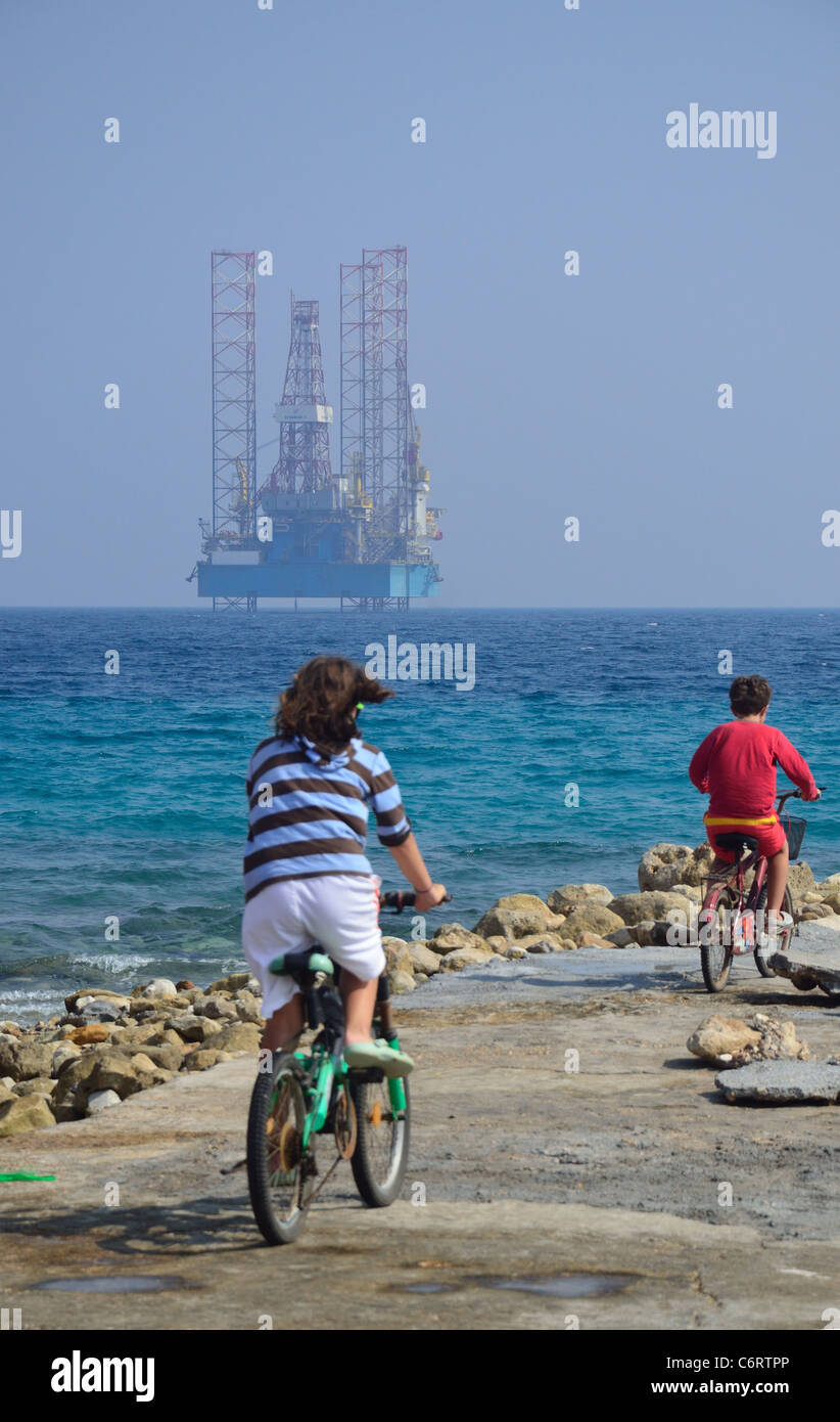 A jackup oil rig lies in the shallow waters of the Red Sea off the coast of Egypt at Ain Sokhna. Stock Photo