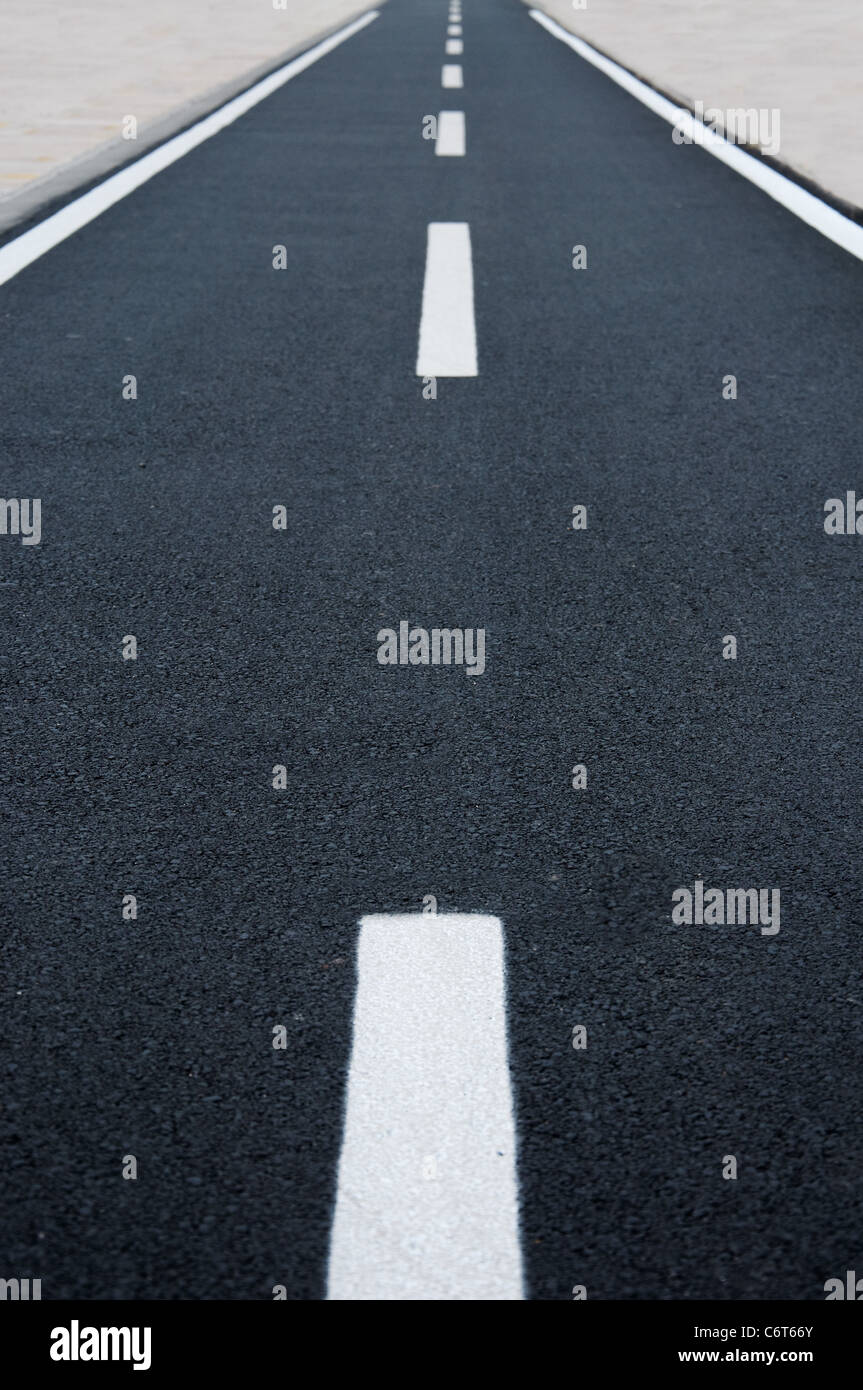 A straight tamac bicycle road Stock Photo - Alamy