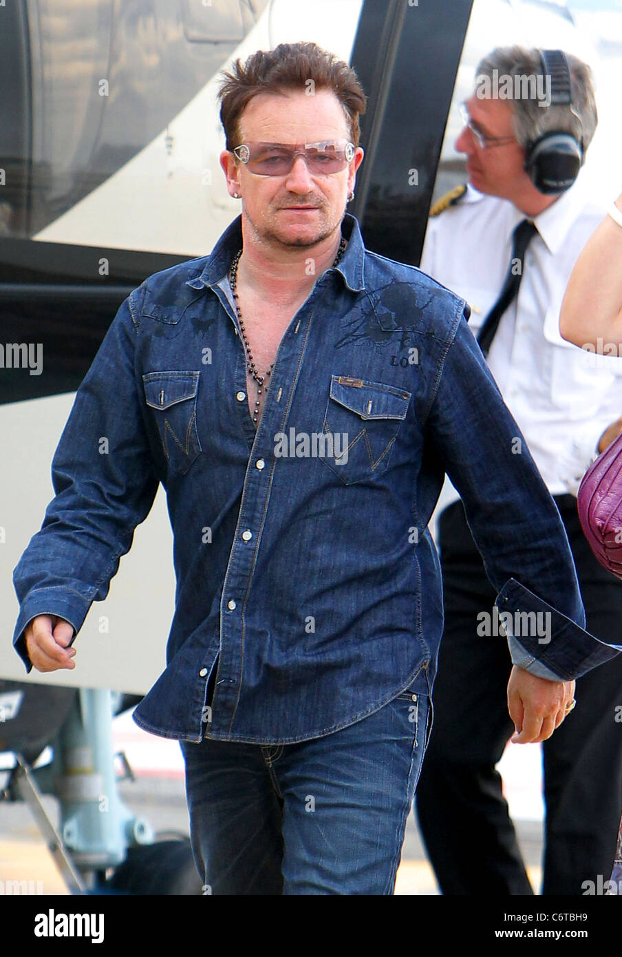U2 rocker Bono arrives at Monaco airport by helicopter following