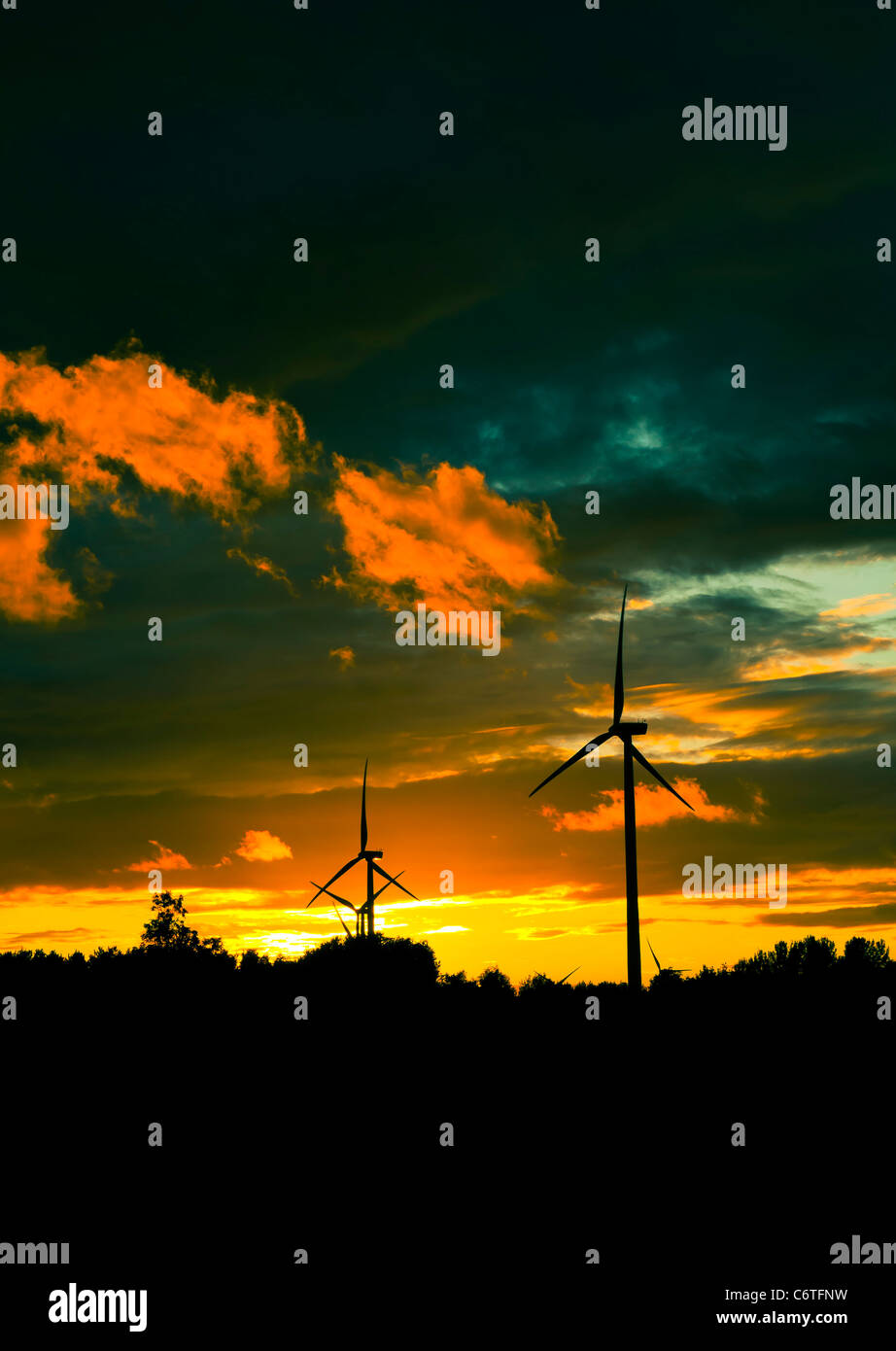 AN image of wind turbines at sunset Stock Photo - Alamy