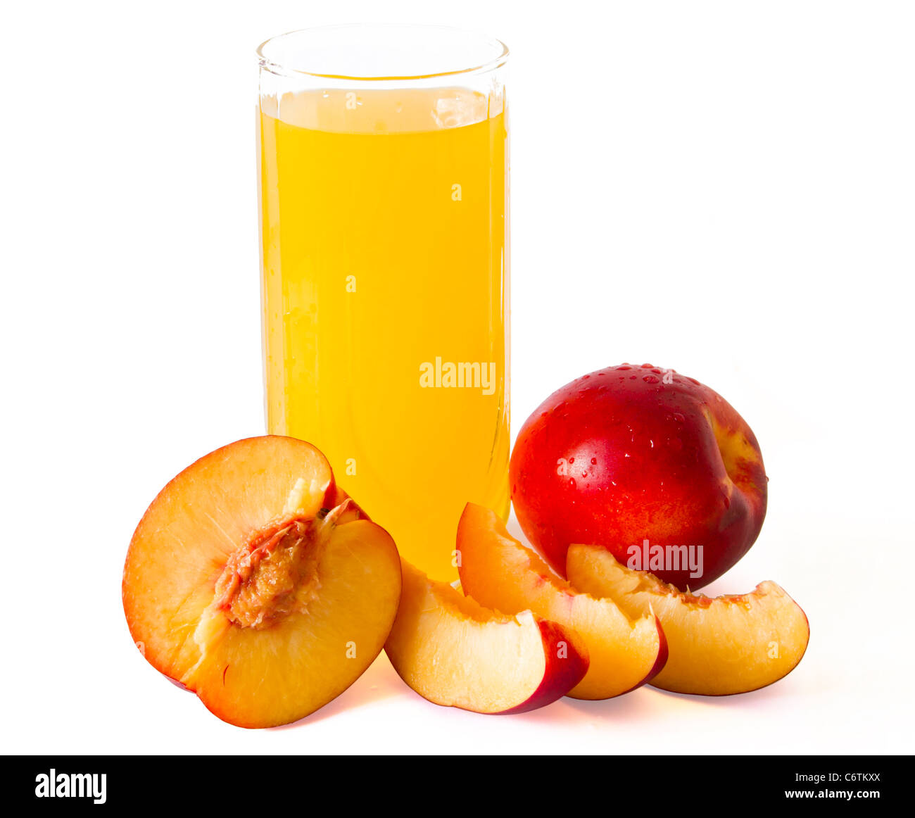 peach juice with peaches around it Stock Photo