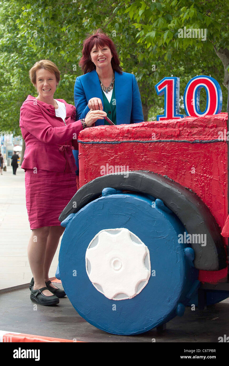 Janet Street Porter and environment secretary Caroline Spelman cut a giant Tractor cake to celebrate 10 years of Great Food and Stock Photo